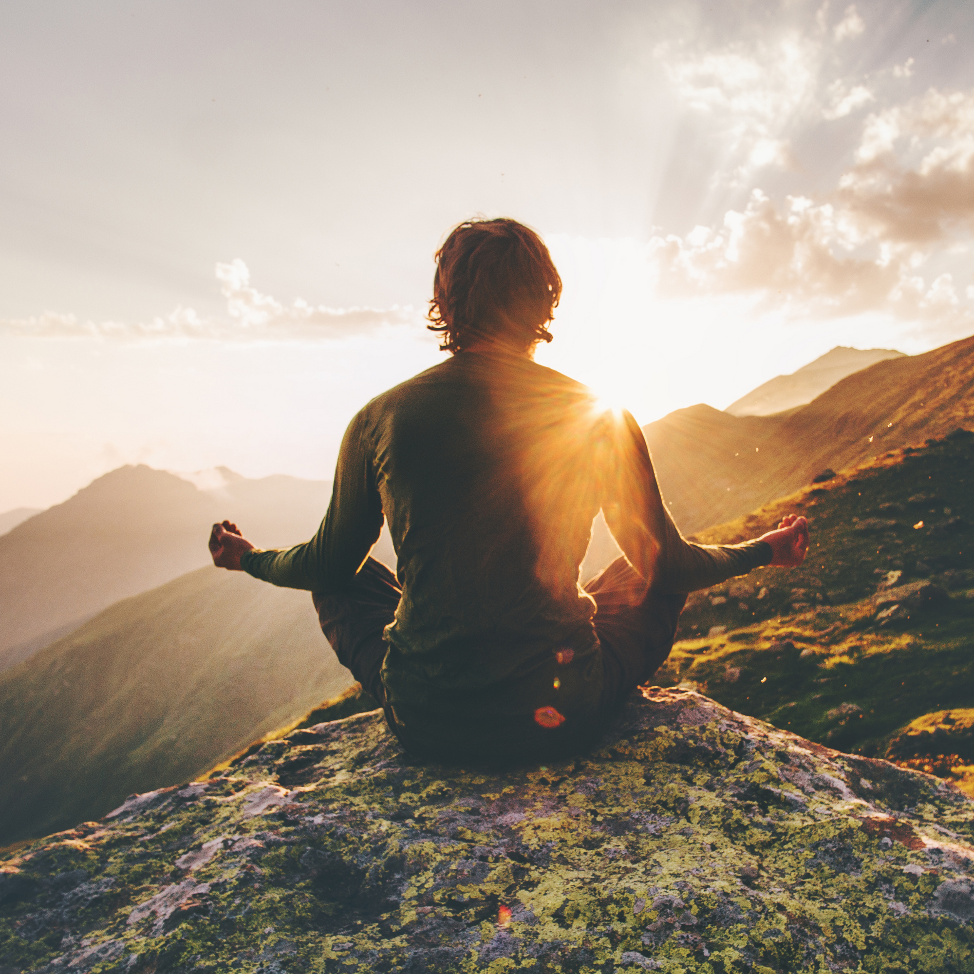 A person practicing mindfulness meditation with &Better, a lifestyle brand promoting holistic wellness and environmental sustainability.