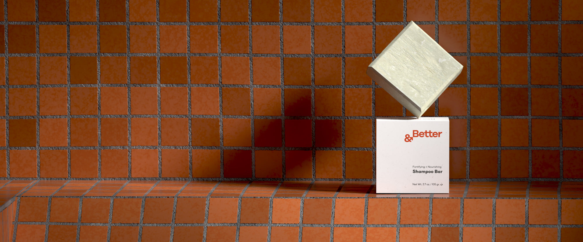 &Better's all-natural, eco-friendly shampoo bar displayed on brick tiles in a minimalist, modern bathroom setting