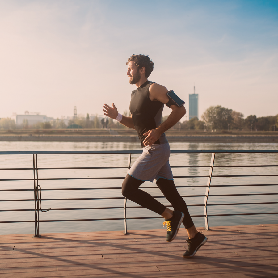 A man is running to start the day, embodying the &Better lifestyle of physical wellness and vitality.