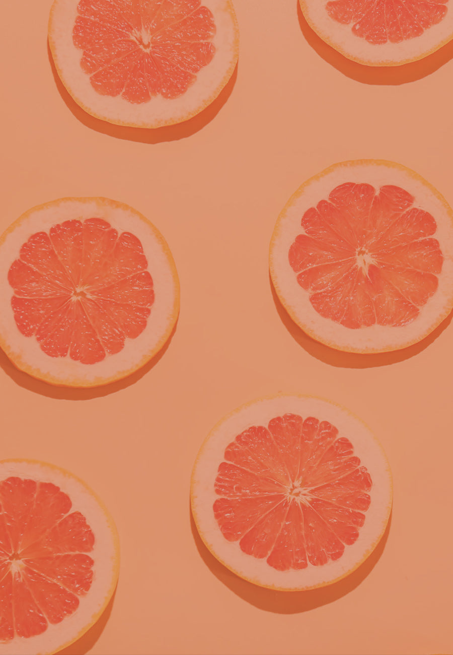 Overhead image of a fresh grapefruit, representing the Citrus scent family of &Better products. The image symbolizes the rejuvenating and invigorating aroma of essential oils, grapefruit, and mint, crafted to elevate your spirit and refresh your senses for an instant mood uplift